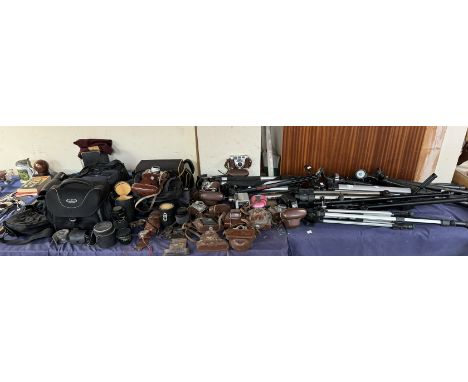 A collection of Kodak cameras together with Retinette cameras, other cameras, lenses, tripods, camera accessories etc