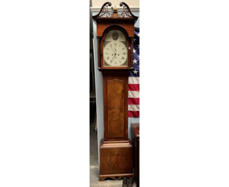 A 19th century mahogany longcase clock, the hood with broken swan neck pediment and corinthian columns above a long trunk doo