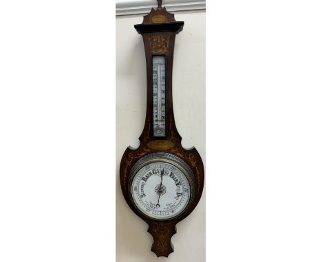 A late 19th century barometer with marquetry decoration of shell, swags and husk, with an alcohol thermometer and porcelain d