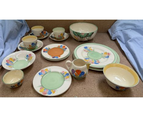 A Clarice Cliff crocus pattern part tea and dinner service including cups and saucers, plates, jug and basin etc and a Rhodan