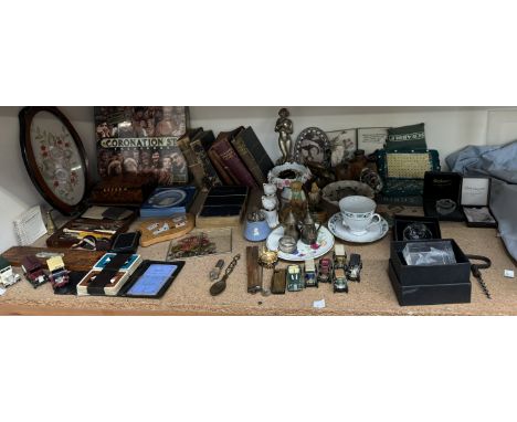 A cribbage board together with books, crystal paperweights, playing cards, white ,metal figure etc 