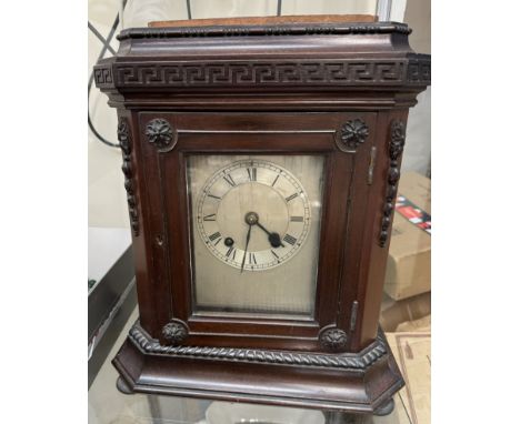 A mahogany bracket clock with a silvered dial and chapter ring 