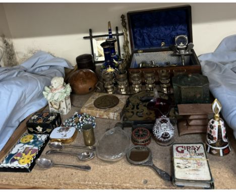 A car mascot together with an electroplated shot tray with glass shot glasses, blue glass decanters, red glass jug, hip flask