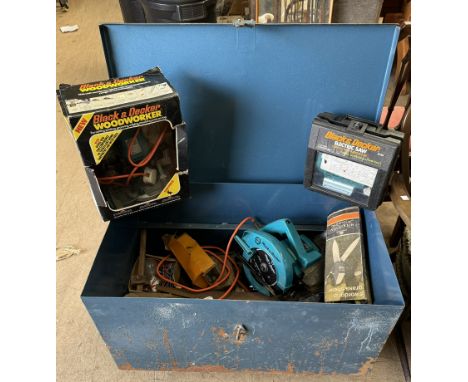 A tin tool chest on casters together with a collection of power and hand tools