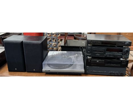 A Garrard record player together with a Technics stereo synthesizer tuner ST-GT350, an Aiwa anti modulation tape stabilizer d