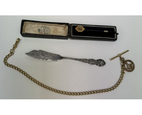 A 9ct gold Masonic pendant on a gilt metal watch chain together with a stick pin and a silver butter knife