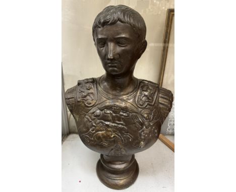 A portrait bust of Julius Caesar on a socle base 