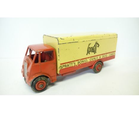 Dinky Toys 917 Guy Van 'Spratts', red cab, chassis and hubs, cream rear body with black lettering. Overall chipping but other
