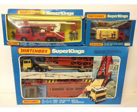 Three Lesney Matchbox King Size models: K-44 Bridge Layer (appears complete); K-39 Snorkel Fire Engine; K-88 Money Box. Appea