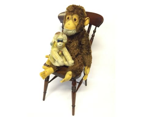 Steiff Chimpanzee, felt face, ears and hands/feet, jointed, working squeaker, height 44cm (VG). Together with a Steiff Mungo 