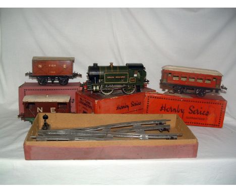 HORNBY 0 Gauge No 1 C/W GWR 0-4-0T no 5500 c1938 and a No 1 NE Fish Van (both Fair Plus), a No 0 Red Mitropa Coach (Fair in a