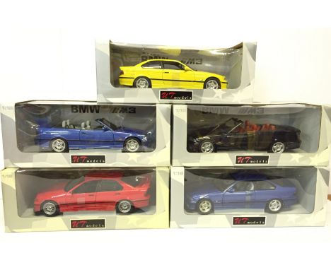 Five UT Models 1/18 scale BMW diecast models: 2 x M3 Cabriolet in techno-violet and black; 2 x E36 M3 Coupe in metallic blue 