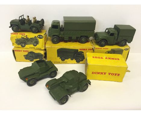Five Dinky Toys military models: 641 Army 1-Ton Cargo Truck; 674 Austin Champ; 673 Scout Car; 623 Army Covered Wagon; 670 Arm
