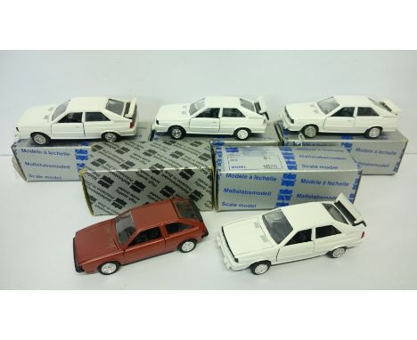 Four Conrad (W.Germany) #1020 Audi Quattro 1/43 die-cast models with unused decals (two with a brake light loose in boot). To