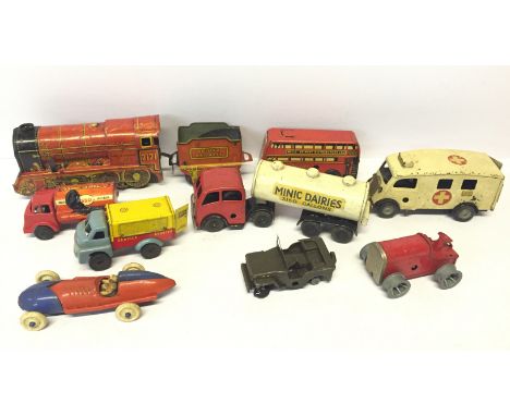 Mixed lot of tinplate and plastic toys, includes Triang Minic 'Minic Dairies' Tanker, LCC Ambulance and Tractor, and a Wells 