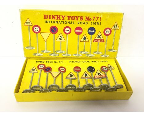 Dinky Toys 771 International Road Signs, comprising of twelve signs including Dangerous Bend and Level Crossing Gates. Some l