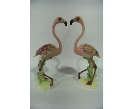 A pair of unusual Goebel models of pink flamingos raised on oval bases, with printed marks to base and impressed numbers 2209