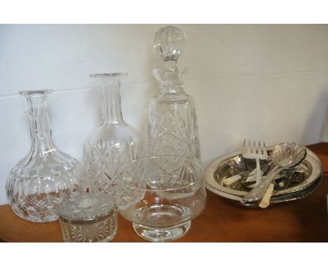 A heavy cut glass club decanter with fan and cross cut detail, a further decanter with extensive cut decoration, a further go