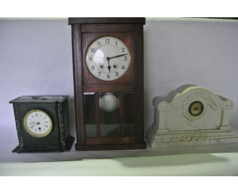 An oak wall clock with partially glazed panelled case and eight day striking movement together with a Victorian black slate a