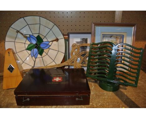 A metronome, a Harmsworth Home Doctor Emergency Case, cast iron book rack, carpet beater, etc