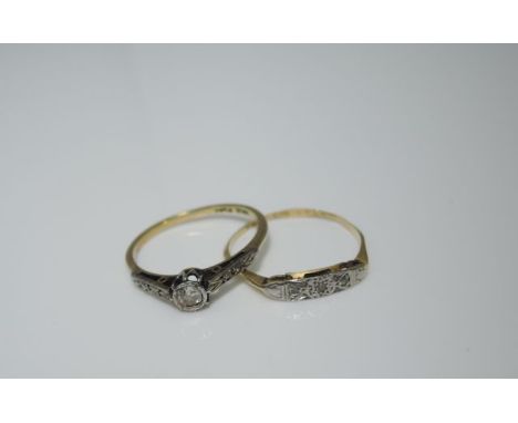 A diamond ring, centred with a collet-set old-cut diamond weighing approximately 0,06cts, the shoulders highlighted with four