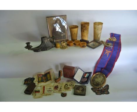 A box of miscellaneous effects, Kensitas silks, napkin rings with bug mounts, Manchester Odd fellows medallion and sash, trav