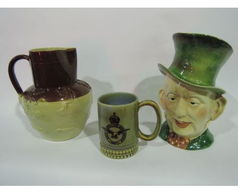 A large Beswick character jug of Micawber with impressed numbers 310 together with a heavy stoneware relief moulded jug with 