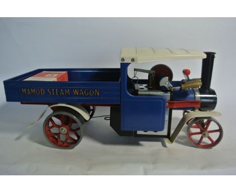 A Mamod steam engine, the bright blue painted lifting carriage with lettering Mamod Steam Wagon, the engine front stamped Mam