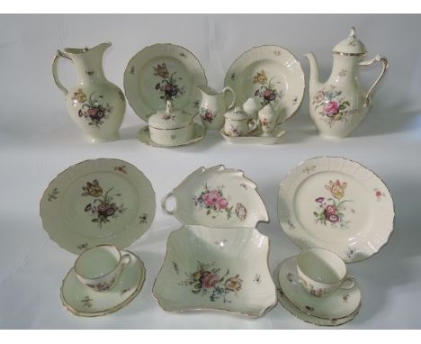 An extensive collection of Royal Copenhagen dinner and coffee wares with printed floral sprigs and sprays on a cream coloured