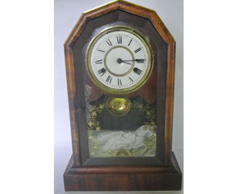An American mantle clock with flamed mahogany case with eight day striking movement