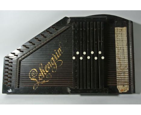 A German zither with ebonised finish, with label to sound hole reading Auta-Harp with further gilt lettering detail