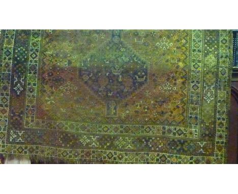 A Persian style wool carpet, the central field with lozenge medallions, animals and flowers and set within running borders