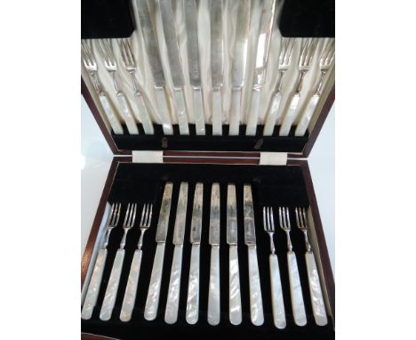 A cased set of silver fruit cutlery 1934-1936 comprising twelve fruit forks and twelve fruit knives, each with mother-of-pear