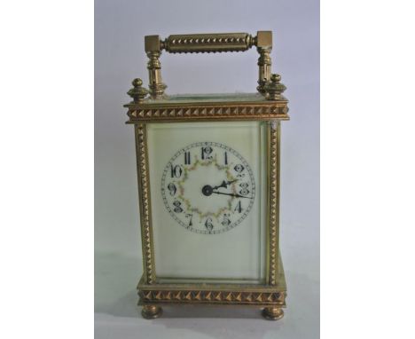 A Victorian carriage clock, the decorative case with dog tooth detail, the enamelled dial with circular and floral painted ch