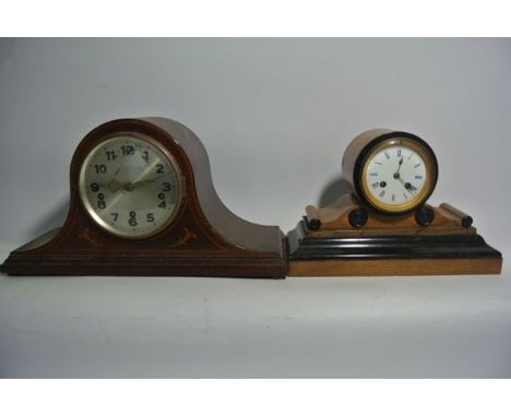 A Victorian oak and ebonised mantle clock, the drum movement enclosed behind a white enamelled dial with blue enamelled numer