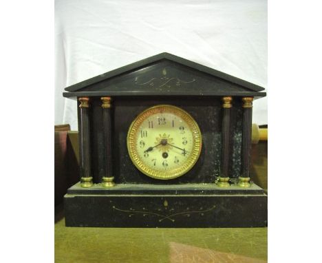 A Victorian black slate mantle clock of architectural form with column supports