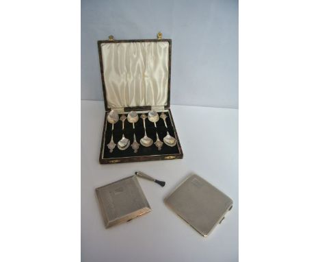 A cased set of six silver teaspoons, Birmingham, 1935-1937, each handle with "The Duke of Wellington's Regt" terminal, 83g in