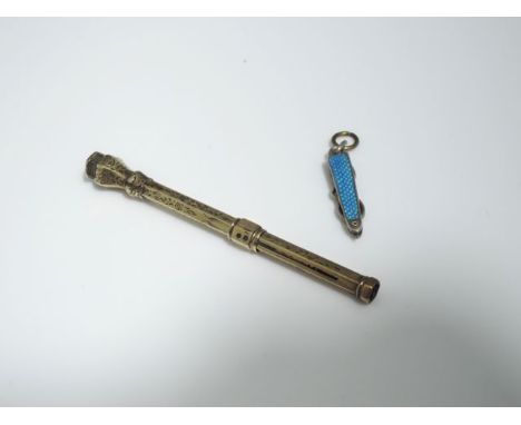 A Victorian unmarked 9ct gold pencil, decorated with flower heads and leaves, the terminal inset with a bloodstone; and an en