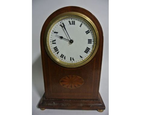 An Edwardian mantle clock, the arched casework with enamelled dial on ball supports