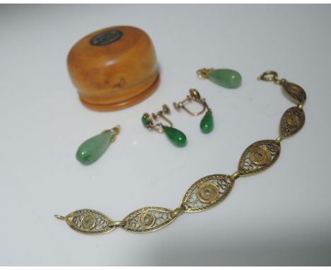 A pair of drop earrings, each suspended with a teardrop shaped nephrite jade, mounted in 14ct gold, screw fittings; a pair of