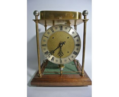 A pin rolling ball clock in mahogany and brass - number 303