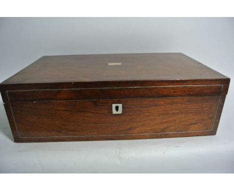 A small 19th century rosewood veneered writing slopes of narrow proportions with white metal inlaid borders and further mothe