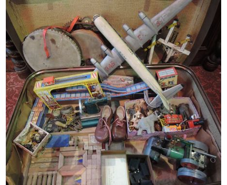 A suitcase containing a collection of vintage toys and related effects to include a large timber model of an aeroplane with p