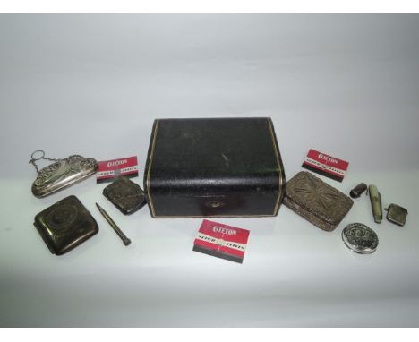 An Edwardian silver cigarette case, Birmingham, 1903, the case flat-chased with leaves and monogram, 44,1 g; an Edwardian sil