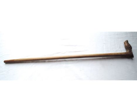 A timber walking stick, the carved handle in the form of a stylised horses head with further carved detail of a bearded male 