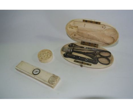 A 19th century etui in ivory containing a set of enamel mounted tools, scissors, needle case, thimble, etc, a 19th century iv