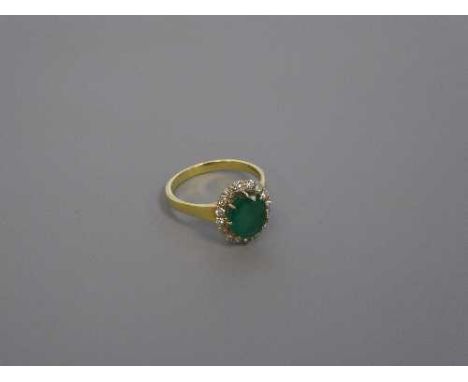 An 18ct gold emerald and diamond cluster ring, size O,  4.5g.