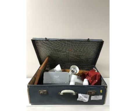 A mid-20th century luggage case containing light fittings, Bakelite telephone, backgammon set, box of glass photo frames etc