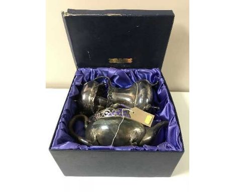 A boxed Reid & Sons three-piece plated tea service