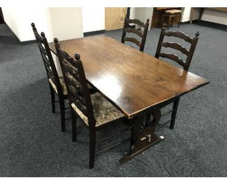 An oak refectory table and four ladder back chairs 